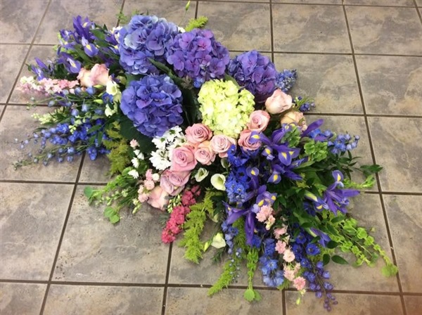 Casket Spray, Garden inspired with blue hydrangea, pink roses , delphinium and Molucella