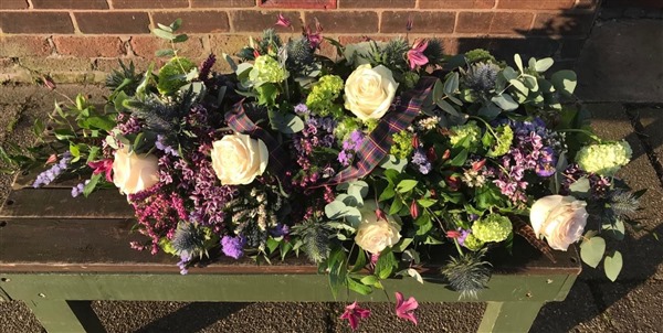 Casket Spray with Scottish theme, Heather, roses, thistle, viburnum and clematis 3 ft