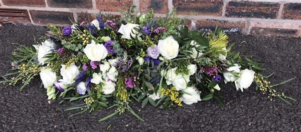Casket Spray. White roses, lisianthus, Mimosa and Heather