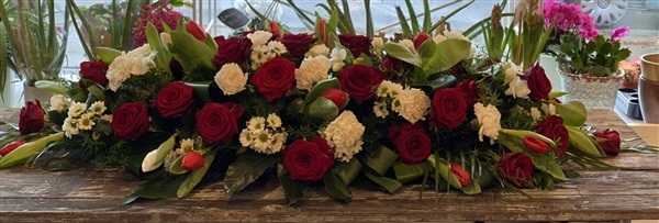 Casket Spray. Red roses, red tulips and Chrysanthemums