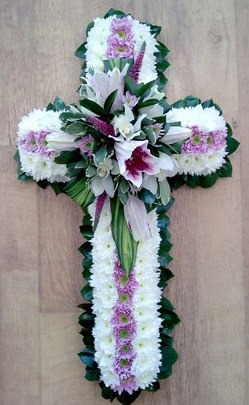 Cross. Massed with pink lily spray