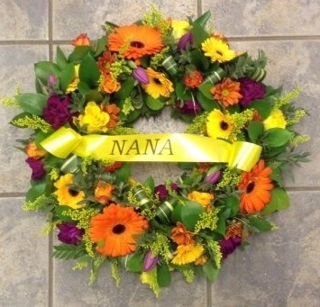 Wreath. Open Style, Orange Gerbera, yellow Germini NANA ribbon 