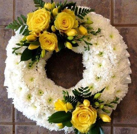 Wreath. Massed with two yellow rose sprays