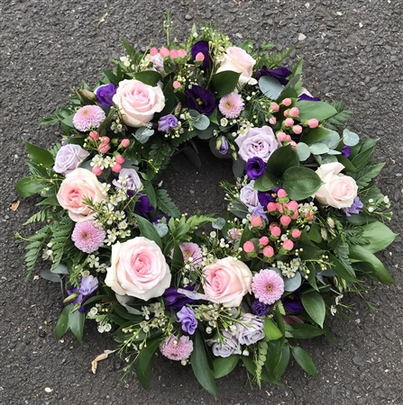 Wreath. Open style. large, pink rose, lilac rose, hypericum , wild, country, foliage.