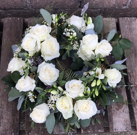 Wreath. Open style. Pure white roses,
