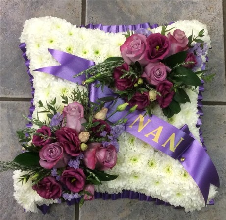 Cushion. Massed. Large pink and lilac sprays. NAN ribbon . Pretty, Traditional