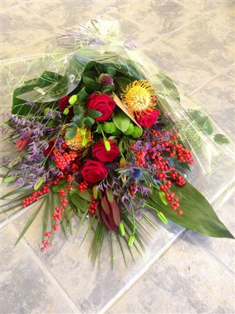 Sheaf. Sheaf of flowers, Funeral Sheaf, Red roses and mixed 