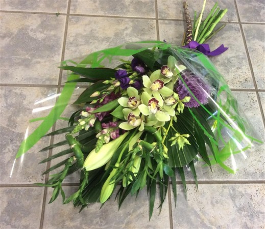 Sheaf. Funeral Sheaf. Orchid and lilies.
