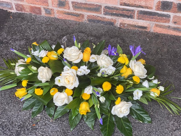 casket spray. White and yellow roses and Iris 2ft
