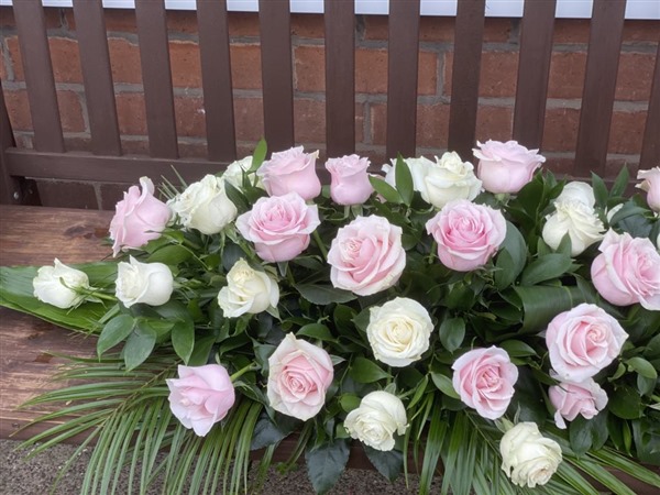 Casket Spray. Classic style pink and white roses only