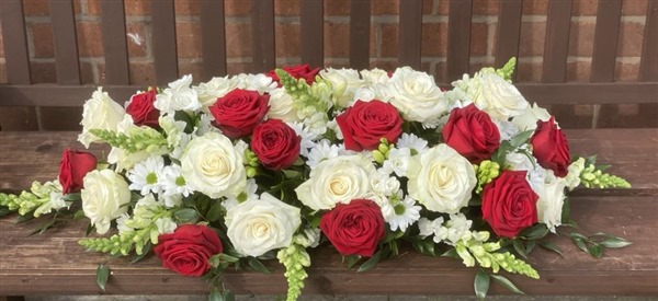 Casket Spray. Red and white roses and Snaps with white Chrysanthemums