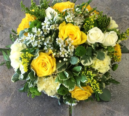 Posy. Small domed posy with yellow roses