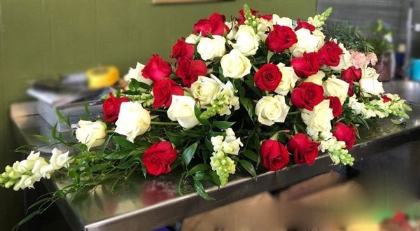 Casket Spray. Red and White roses and snaps. Formal style. 4ft