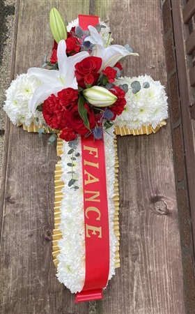 Cross. Massed with red and white spray